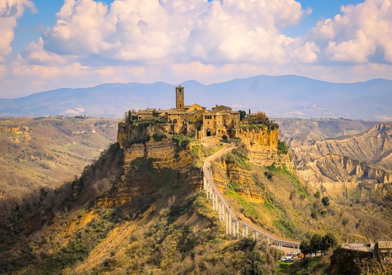 Civita di Bagnoregio and its footbridge in warm evening light