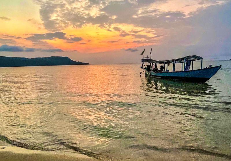 A fishing boat at sunset off the Cambodian coast