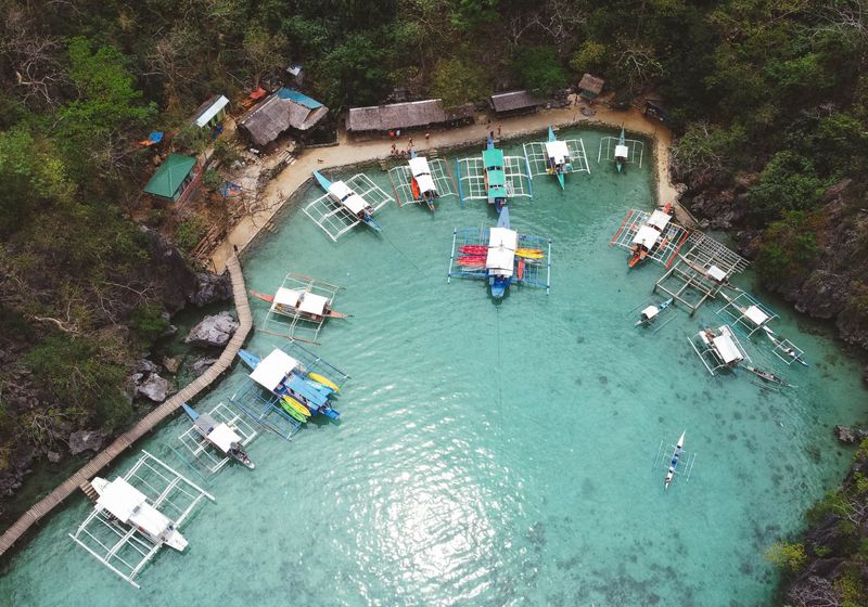Aerial view of a lagoon with traditional bangka boats
